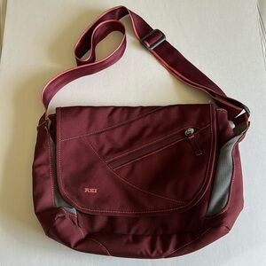 REI crossbody travel purse, zippered compartments, lightweight, adjustable strap